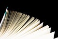 Open book on black background, top view, copy space Royalty Free Stock Photo