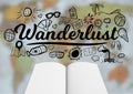 Open book with black wanderlust doodles against blurry map Royalty Free Stock Photo