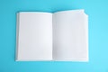 Open book with blank pages on blue background Royalty Free Stock Photo