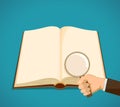Open book with blank pages. Man holds a magnifying glass Royalty Free Stock Photo