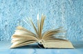 Open book on blue background. Reading,literature,education,library,home office, back to school concept,selective focus,copy Royalty Free Stock Photo