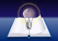 Open book with bright glowing light bulb above on blue background. Education, idea and insight concept. Realistic design Royalty Free Stock Photo