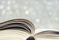 Open book, close up on blur bubbles background. Reading,learning, education Royalty Free Stock Photo