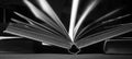 Open book close up,selective focus,black and white, home office,reading, education, knowledge concept Royalty Free Stock Photo