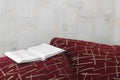 Open book on the couch Royalty Free Stock Photo