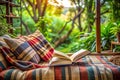 Open book on cozy bed near window with garden view Royalty Free Stock Photo