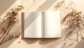 Open Book with Dried Flowers and Sunlight Shadows Royalty Free Stock Photo