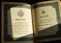 Open book featuring both English and Arabic script. The page on the left is titled Royalty Free Stock Photo