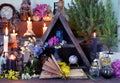 Open book with flowers, candles and magic bottles on witch table Royalty Free Stock Photo