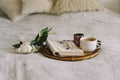 Open book with glasses, cup coffee and bouquet white pink peonies flowers Royalty Free Stock Photo