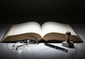 Open book with glasses and pen on table Royalty Free Stock Photo