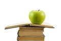 Open book with green apple Royalty Free Stock Photo