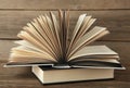 Open book on grey wooden background. Space for text Royalty Free Stock Photo