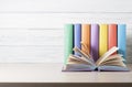 Open book, hardback books on wooden table. Education background. Back to school. Copy space for text. Royalty Free Stock Photo