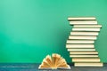 Open book, hardback books on wooden table, on a green background. Back to school. Copy space for text. Education background Royalty Free Stock Photo