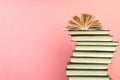 Open book, hardback books on wooden table, on a pink background. Back to school. Copy space for text. Education background Royalty Free Stock Photo
