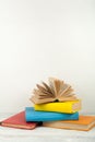 Open book, hardback colorful books on wooden table. Back to school. Copy space for text. Education business concept Royalty Free Stock Photo