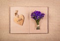 Open book, heart bookmark and flowers. Romantic concept. Royalty Free Stock Photo