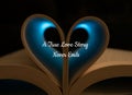 Open Book with Heart Shaped Pages with Blue Light Shining Through, Love Quote Royalty Free Stock Photo