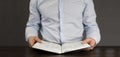 The open book is the holy bible. Young man in a shirt. Prayer and Scripture Reading Royalty Free Stock Photo