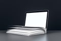 Open book and laptop on a dark background. 3D Rendering Royalty Free Stock Photo