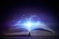 Open book with magic glowing. Fairy tale Royalty Free Stock Photo