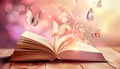 Open book with magic light and glowing butterflies flying out of it on wooden table against light pink bokeh background Royalty Free Stock Photo