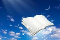 Open book with magic sparkle flying on night sky background. Reading and Writing concept Royalty Free Stock Photo