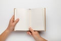 A5 open book mockup with hands. Empty template of page. Blank for design. Isolated on white background Royalty Free Stock Photo