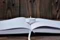 Open book or notebook. On the book is a small candle. Royalty Free Stock Photo
