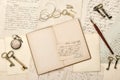Open book, old letters, antique accessories. Vintage background Royalty Free Stock Photo