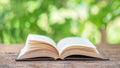 Open book outdoor. Selective focus.Opened book on bright background