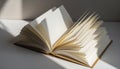 Open Book with Pages Fluttering in Sunlight Royalty Free Stock Photo