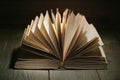 An open book with open pages, a thick old book on the table, knowledge and education Royalty Free Stock Photo