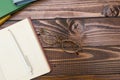 Open book, pen and glasses on a wooden table Royalty Free Stock Photo