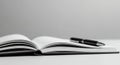 Open Book and Pen on a Table Royalty Free Stock Photo