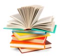 The open book on a pile of multi-coloured books. Royalty Free Stock Photo