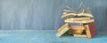 Open Book on a pile of old books, panorama Royalty Free Stock Photo