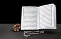 Open Book of Quran With Rosary and Dates Royalty Free Stock Photo