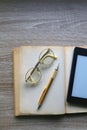 Open Book, Reading Glasses and E-Reader Royalty Free Stock Photo