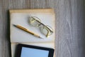 Open Book, Reading Glasses and E-Reader Royalty Free Stock Photo