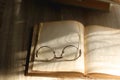 Open Book and Reading Glasses Royalty Free Stock Photo