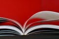 Open book on red background Royalty Free Stock Photo