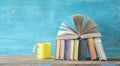 Open book on a row of books, cup of coffee, flat lay, reading, education, literature, Royalty Free Stock Photo