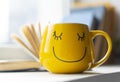 open book smiley yellow cup. High quality photo