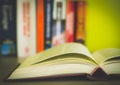 Open book, stack of colorful hardback books isolated on white background. Back to school. Copy space for text. Toned image Royalty Free Stock Photo