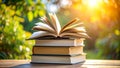 Open book on stack with sunlight and blurred green background, education concept Royalty Free Stock Photo