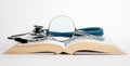 Open book with stethoscope and magnifier. Medical education concept. Conducting research in medicine field. Search of