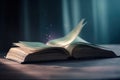 an open book on a table with a blurry background Royalty Free Stock Photo