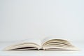 Open book on the table. A book with a white page on a light empty background. Education, school, study, reading concept Royalty Free Stock Photo